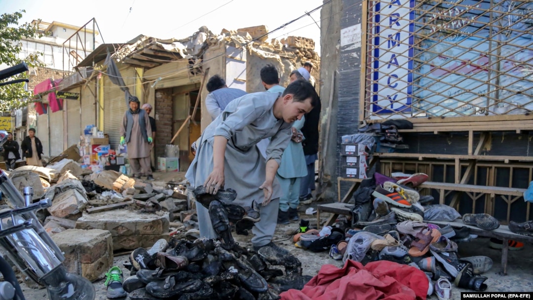 People gather at the scene of a previous blast in Kabul's Dasht-e Barchi area. (file photo)