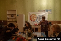 Volunteers offer hot drinks, meals, and shelter and advise on further steps for the refugees coming into Ukraine.