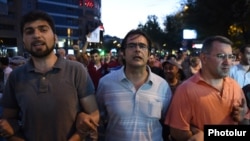 Armenia - Opposition activists Andrias Ghukasian (C), Armen Martirosian (R) and Davit Sanasarian lead an anti-government march in Yerevan, 29Jul2016.