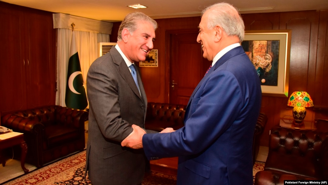 Pakistani Foreign Minister Shah Mahmud Qureshi (left) receives Zalmay Khalilzad in Islamabad on January 18.
