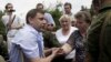В Донецке люди требуют остановить обстрелы жилых районов
