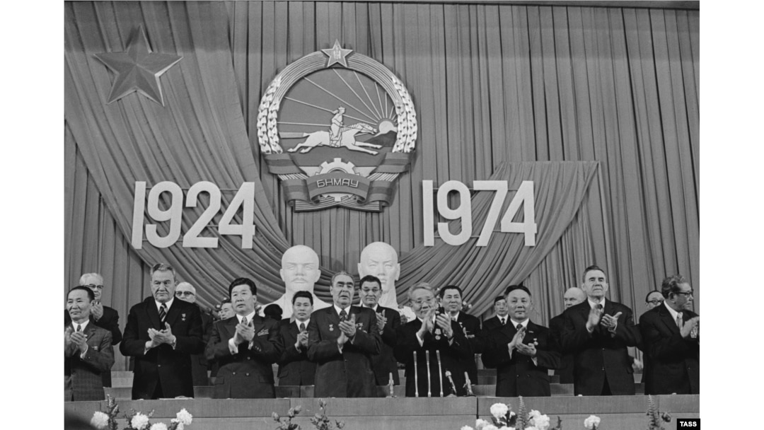 Soviet leader Leonid Brezhnev (center left) marks 50 years of the Mongolian People's Republic alongside Mongolia's communist leader Yumjaagiin Tsedenbal (center right) in Ulan Bator on November 1, 1974.