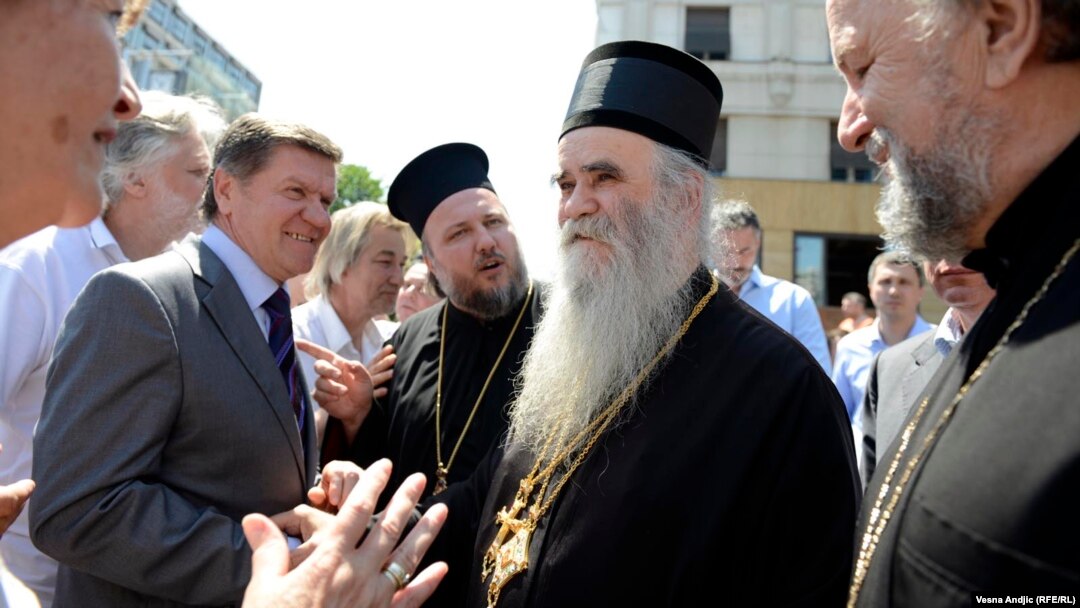 At a rally in Belgrade on May 10 against a normalization deal between Serbia and Kosovo, Bishop Atanasije (second from right) compared Prime Minister Ivica Dacic to former Prime Minister Zoran Djindjic, who was assassinated in 2003.
