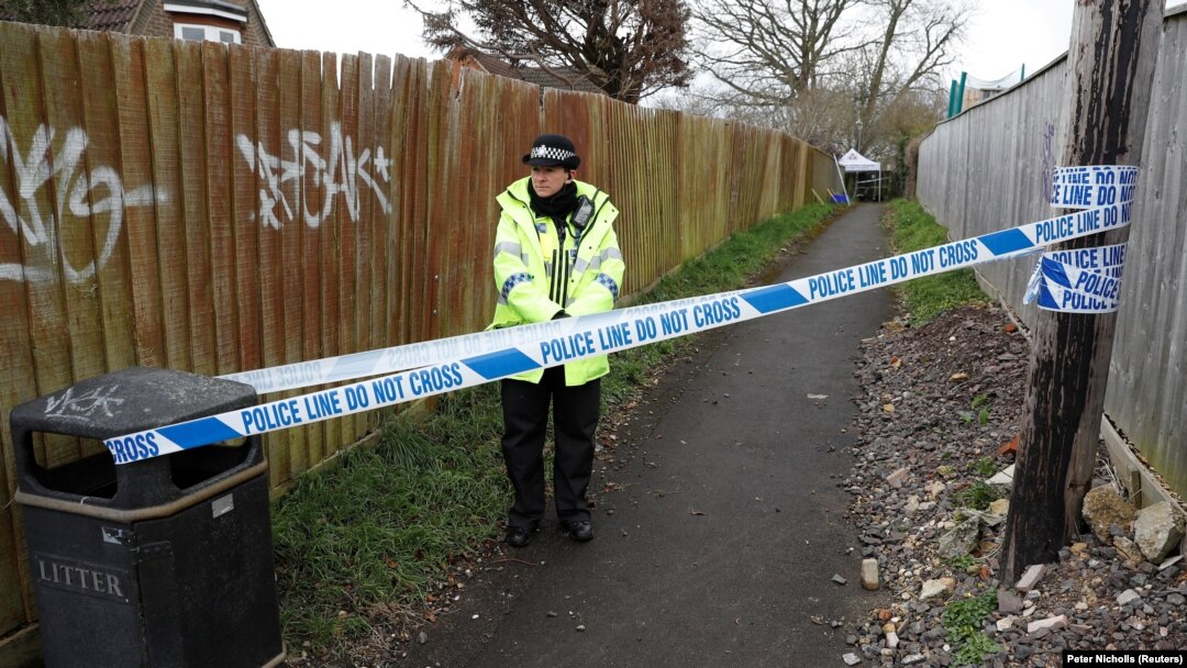 A police officer stands behind cordon near the home of Russian ex-spy Sergei Skripal in Salisbury, England.