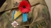 Generic – A remembrance poppy and Ukrainian soldier
