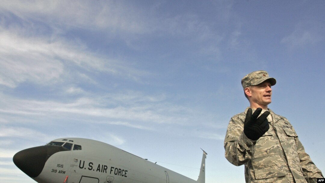 A U.S. officer on the runway at the Manas air base