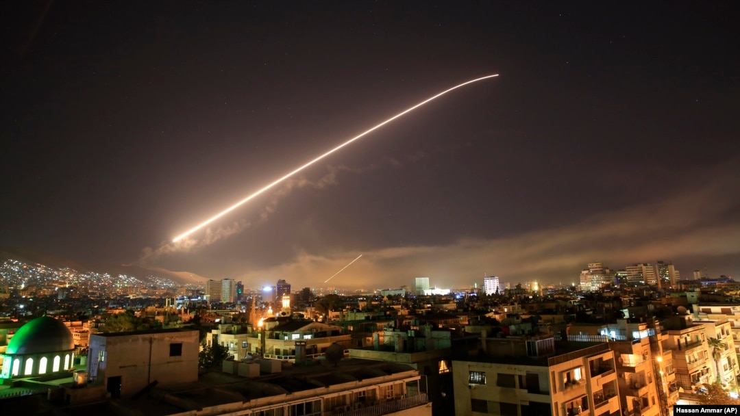 The Damascus sky lit up with missile fire as the U.S. and its allies attack Syria on April 14.