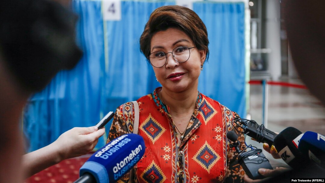 Singer Roza Rymbaeva talks to reporters after voting in Almaty on June 9.