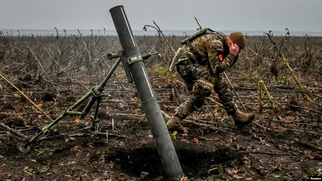 A Ukrainian soldier fires a mortar on the front line in the Zaporizhzhya region on November 16.