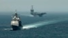 Американський ракетний крейсер USS Gettysburg (CG 64) та авіаносець USS Harry S. Truman (CVN 75) йдуть транзитом через Гібралтарську протоку до Середземного моря, 3 вересня 2013 року