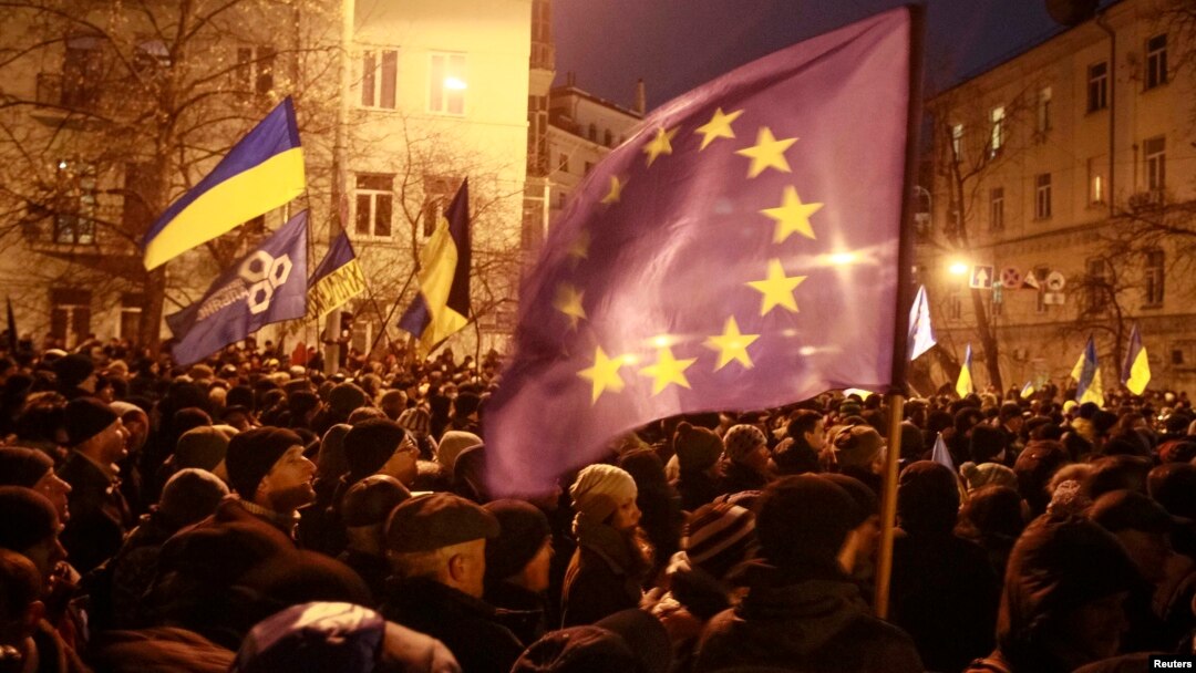 People attending a rally held by supporters of EU integration near the presidential administration building in Kyiv on December 3. 