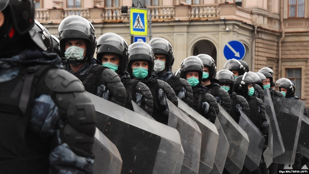 "Just plain, old-fashioned authoritarianism”? Russian riot police block a street during a rally in support of jailed Kremlin critic Aleksei Navalny in central St. Petersburg on April 21.